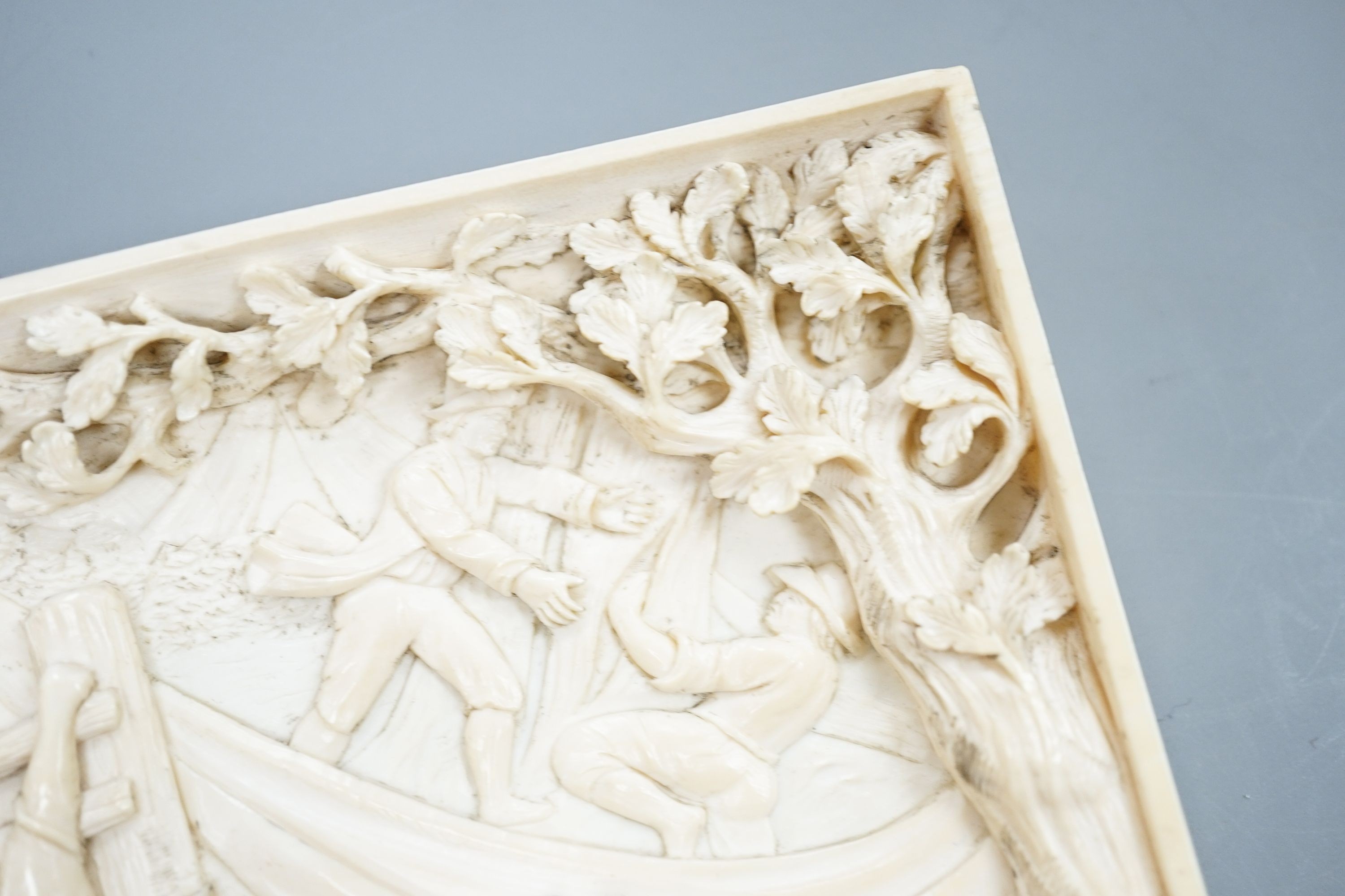 An 18th century Flemish carved ivory plaque (initials OF?) with scenes of hunters and village life, 15 x 28cm